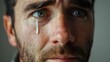 © Anna Zhuk - Portrait of frustrated man shedding tears, expressing deep emotion and vulnerability, capturing the raw and poignant beauty of human emotions