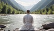 A man in a white robe meditating against a mountain river background