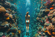 Caucasian girl in a mask swims on a coral reef