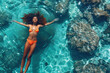 © sofiko14 - Young African woman swimming on surface of tropical sea