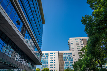 Canvas Print - Close-up of a modern business city building looking up