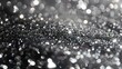 Sparkling monochrome bokeh background with glittering particles.