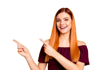 Poster - Close up portrait of cheerfully laughing young woman showing by her fingers on yellow background with copy space for text