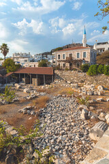 Wall Mural - The ruins of the Mausoleum at Halicarnassus (Tomb of Mausolus), Cityscape at background. Cover page. Bodrum, Turkiye (Turkey)