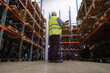 © Westend61 - Senior auto mechanic taking standing amidst shelves at warehouse