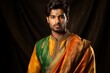 
Photo of a Kshatriya young man in traditional Indian attire, donning a colorful sherwani or kurta with a dhoti or churidar, exuding confidence and strength befitting his Kshatriya lineage