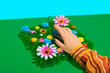 © Westend61 - Hand of businesswoman touching computer mouse kept on flowerbed