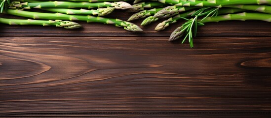 Wall Mural - Fresh Asparagus Display on Rustic Wooden Table Setting with Copy Space