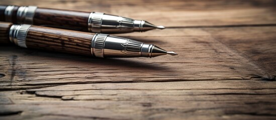 Aufkleber - Elegant Writing Instruments Resting on Rustic Wooden Surface with Grains Texture