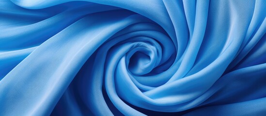 Poster - Elegant Blue Fabric Swirling in a Circular Spiral Pattern Top View - Textile Background