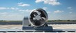 © HN Works - Industrial Air Ventilator on Office Roof Spinning in the Wind