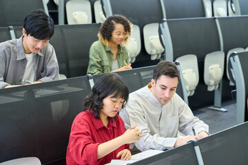 Aufkleber - Multinational group of students taking a lecture in the auditorium