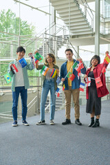 Poster - Multinational people holding national flags. International relationship.