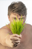 Fototapeta Mapy - boy with a bunch of grass