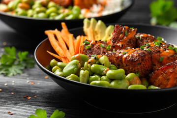 Wall Mural - Firecracker salmon poke bowl with edamame, avocado carrot and rice