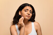 © Prostock-studio - Upset Young Indian Woman Demonstrating Problems On Her Skin