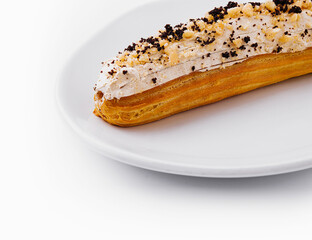 Wall Mural - Eclair with cream and chocolate on plate