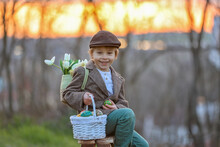 Beautiful Stylish Toddler Child, Boy, Playing With Easter Decoration In The Park, Springtime