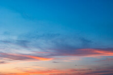 Beautiful partly cloudy sky at sunset or sunrise with pastel colors