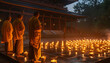Monks performing a serene candlelight ceremony at a Buddhist temple - illustrating the sacred rituals and calming spirituality of Buddhism.