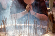 burning sticks in a temple