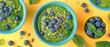Vibrant spirulina smoothie bowls topped with fresh blueberries, pumpkin seeds on a sunny yellow backdrop