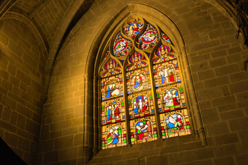 tained window and interior of medieval gothic church of vitre, bretagne, france