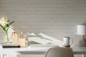 Poster - Home office desk with houseplant, cup of coffee and book. Copy space for your text.