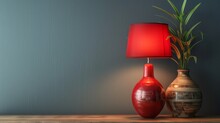 Close-up View Of Red Table Lamp On A Table And Lucky Bamboo (Dracaena Sanderiana) In A Ceramic Vase. Interior Details Of Modern Room. Combination Of Classic And Oriental Ambience.