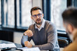 © Dusan Petkovic - Portrait of a businessman discussing on a briefing at meeting room.