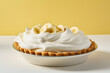 Banana cream pie on yellow and white background