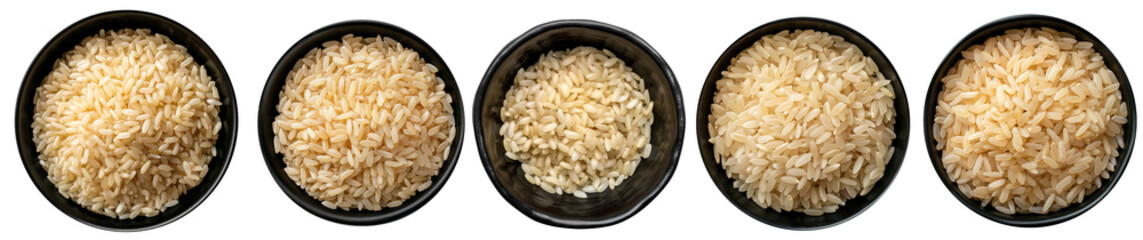 Top view bowls with raw carnaroli rice isolated on a black surface