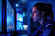 © SHOTPRIME STUDIO - Female professional in blue uniform working attentively on computer screen in modern office environment