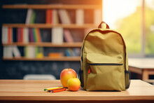School Backpack With Stationery On Table In Classroom