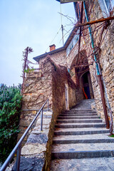 Poster - Narrow street with steep staircases in old Gandria village, Switzerland