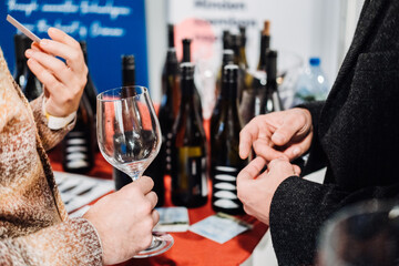 Trade Visitors Networking Over Wine Tasting at Wine Fair