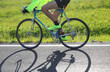 © ChiccoDodiFC - young cyclist on racing bike on the street in backlight and shadow on asphalt