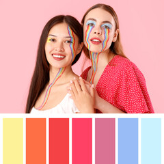 Wall Mural - Young women with painted faces hugging on pink background, closeup