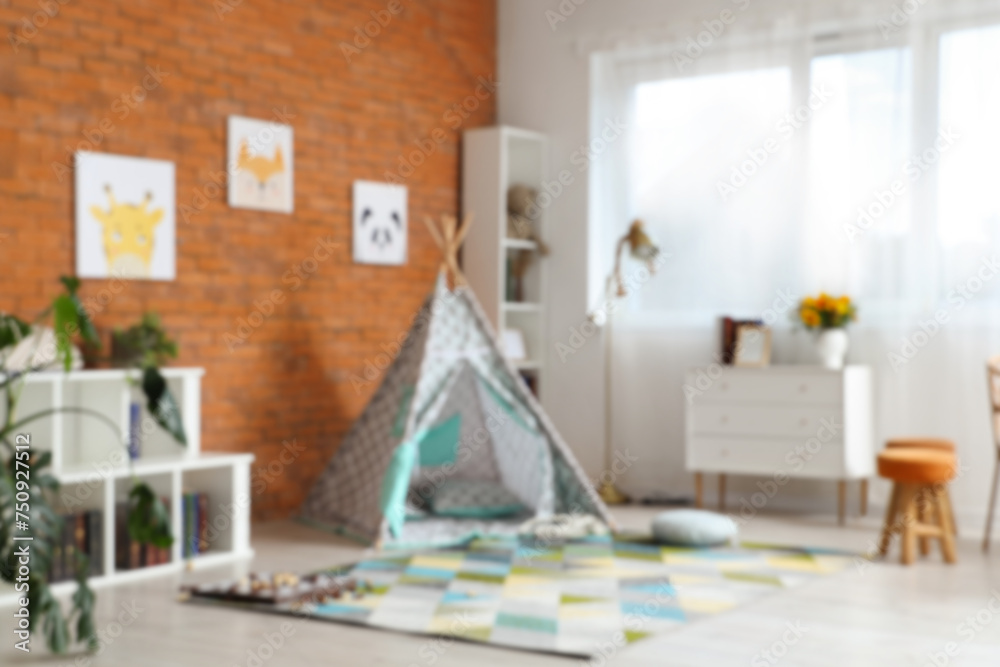 Blurred view of children's room with play tent