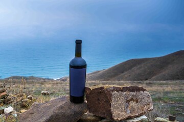 Canvas Print - Bottle of wine in the mountains