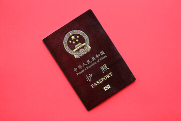 Wall Mural - Red passport of People Republic of China. PRC chinese passport on bright background close up