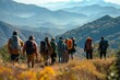 © Road Red Runner - A group of people with backpacks enjoying the view at the summit of a hill after a hiking adventure.