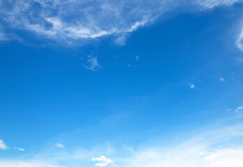 Wall Mural - background of blue sky and white clouds soft focus and copy space horizontal shape.