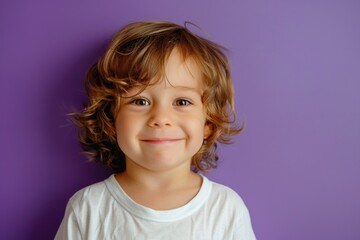 Canvas Print - A happy young girl with curly hair smiling at the camera. Suitable for various projects and designs