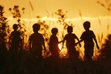 Fototapeta Tulipany - Group of children in a field at sunset. Suitable for various outdoor activities promotions