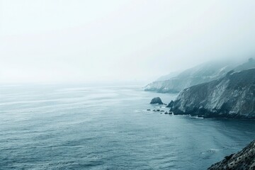 Poster - A scenic view of a large body of water next to a cliff. Perfect for travel or nature-themed projects
