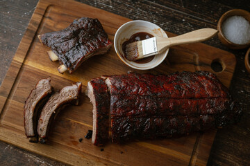 Sticker - sliced barbeque spare ribs on wooden board