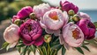 bouquet of pink and purple peonies arranged in a bunch with visible stems