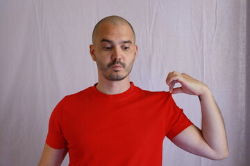 Sticker - casual bald man in red shirt making hand gestures