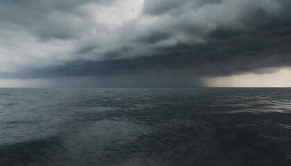 Wall Mural - dark sea surface with a dramatic cloudy sky above approaching storm